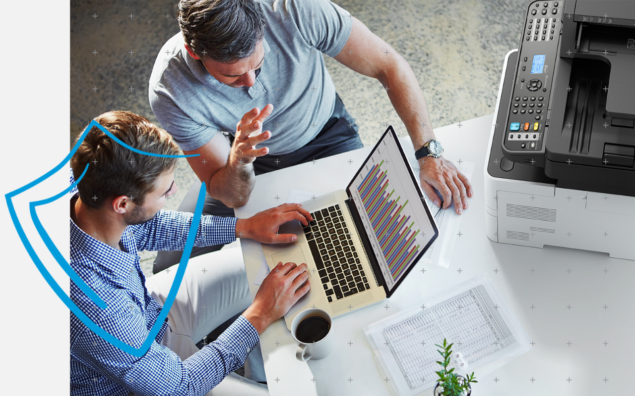 Close up of hand plugging a USB stick into a laptop